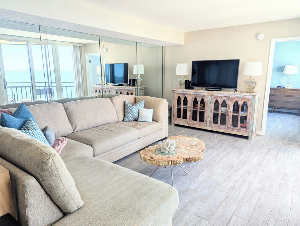 Large, comfortable sectional and smart TV with cable/streaming services.