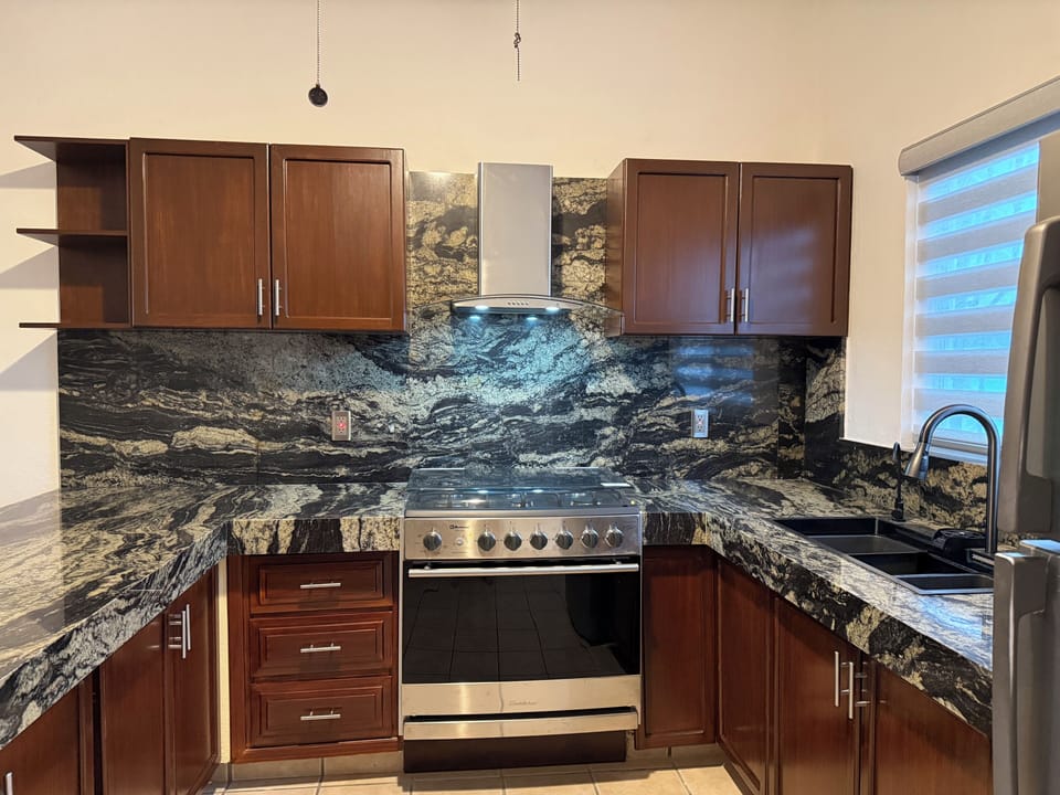 Brand new granite kitchen and custom cabinets