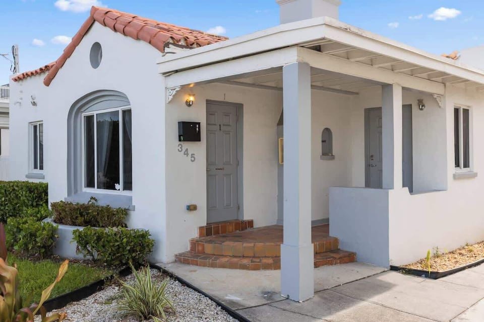 Charming and coastal 🌴 This South Florida vacation rental features Mediterranean architecture, a private porch, and tropical landscaping—perfect for families or long-term stays.