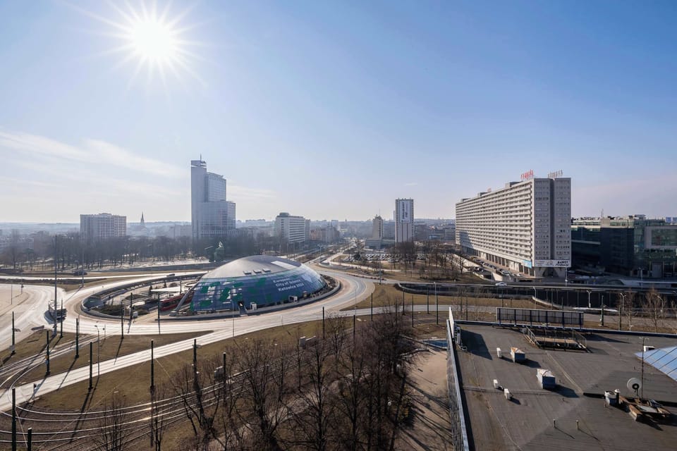 Another city view showcasing a modern urban area with high-rise buildings and open spaces.