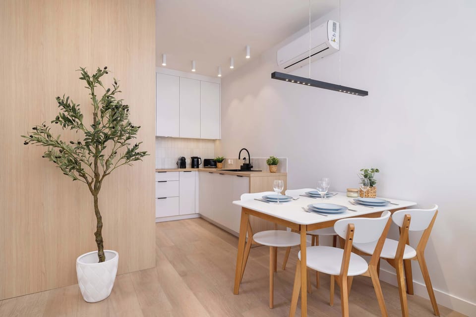 The dining area connected to the kitchen creates a cohesive and functional space for shared meals.