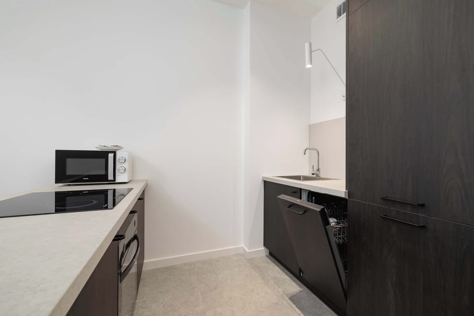 The kitchenette's practical layout maximizes space and functionality.