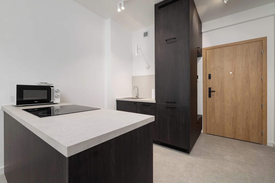 Cook and dine in style with the modern kitchenette and dining area.