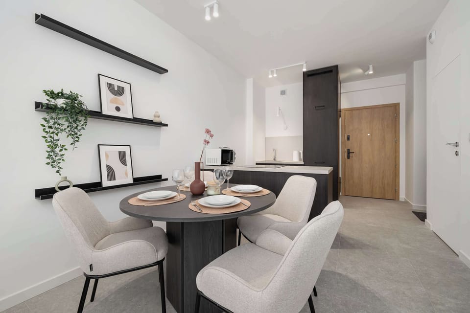 A large dining table with chairs is perfect for family meals.
