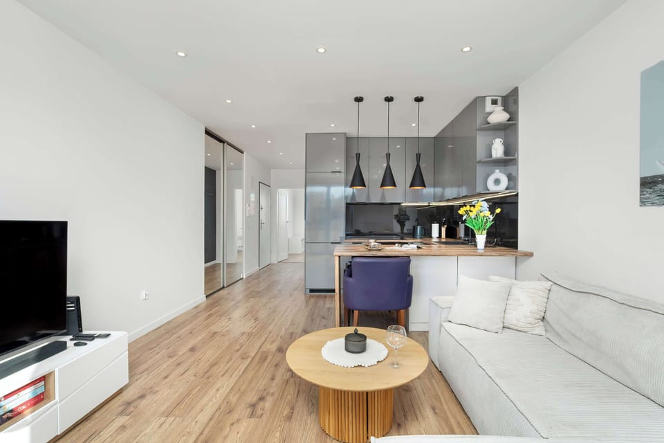 The open layout connects the living room with the kitchen and dining area, creating a comfortable hub for daily life and socializing.