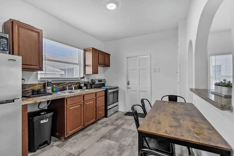 Functional and inviting 🏡 This South Florida vacation rental features a full kitchen, dining space, and natural light—ideal for families or long-term guests.