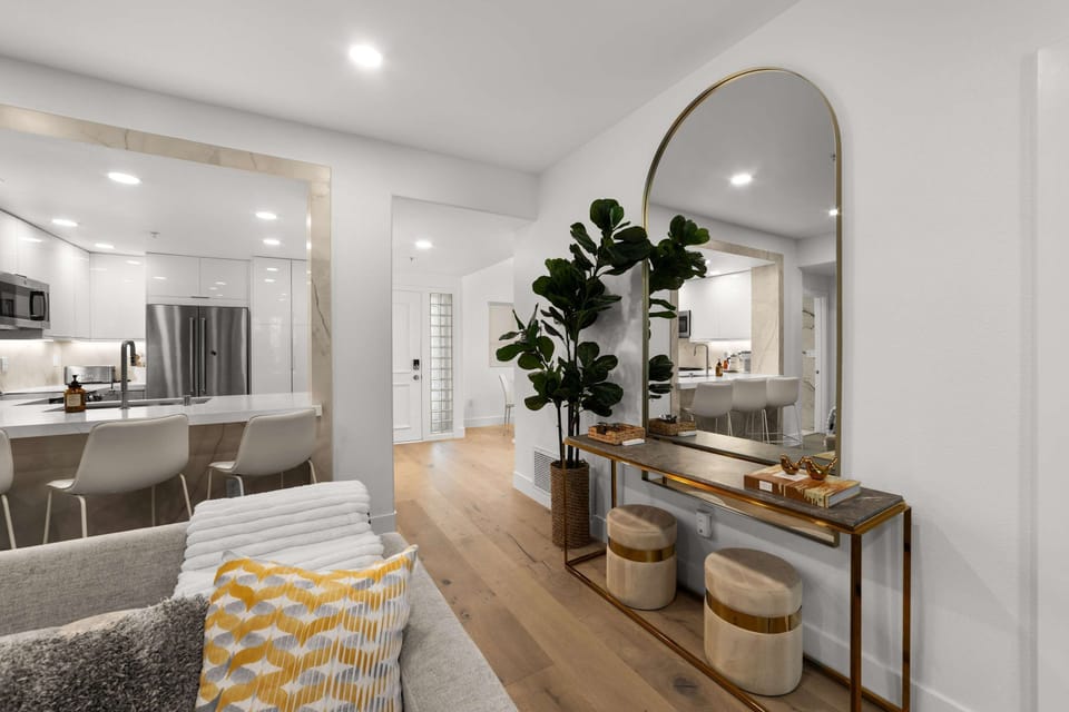 Open living space with cozy fireplace and wall-mounted smart TV