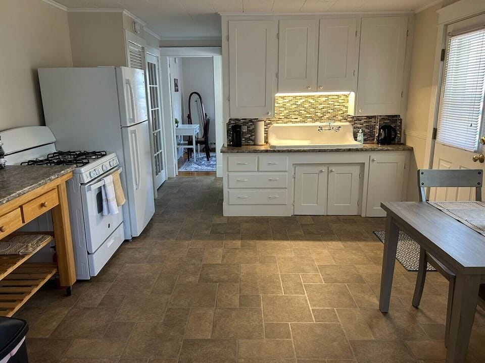 Full kitchen with all the basic cookware and utensils available