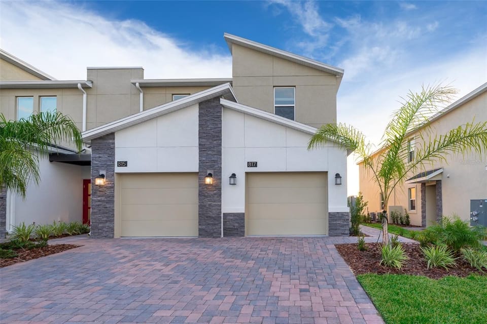 Beautiful exterior with private driveway — a warm welcome to your Champions Gate home