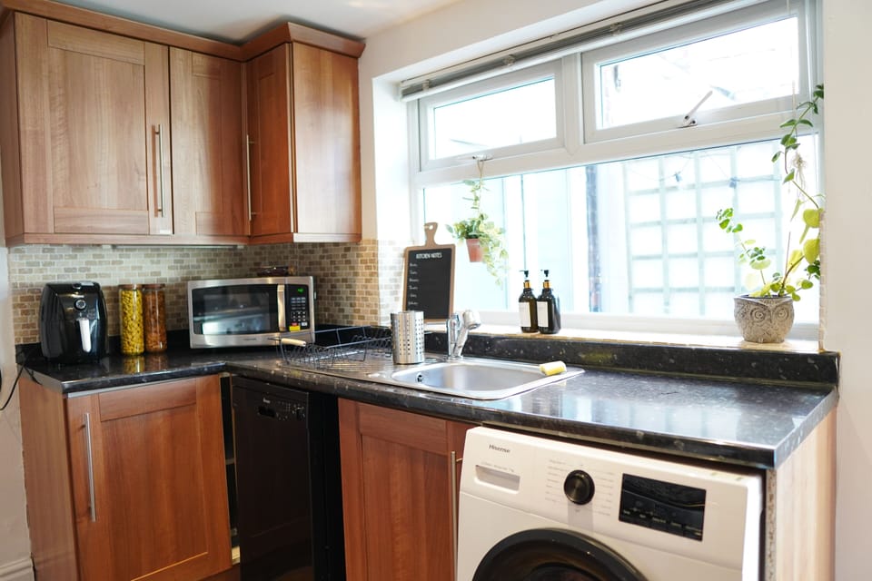Bright kitchen with modern appliances and natural light. 