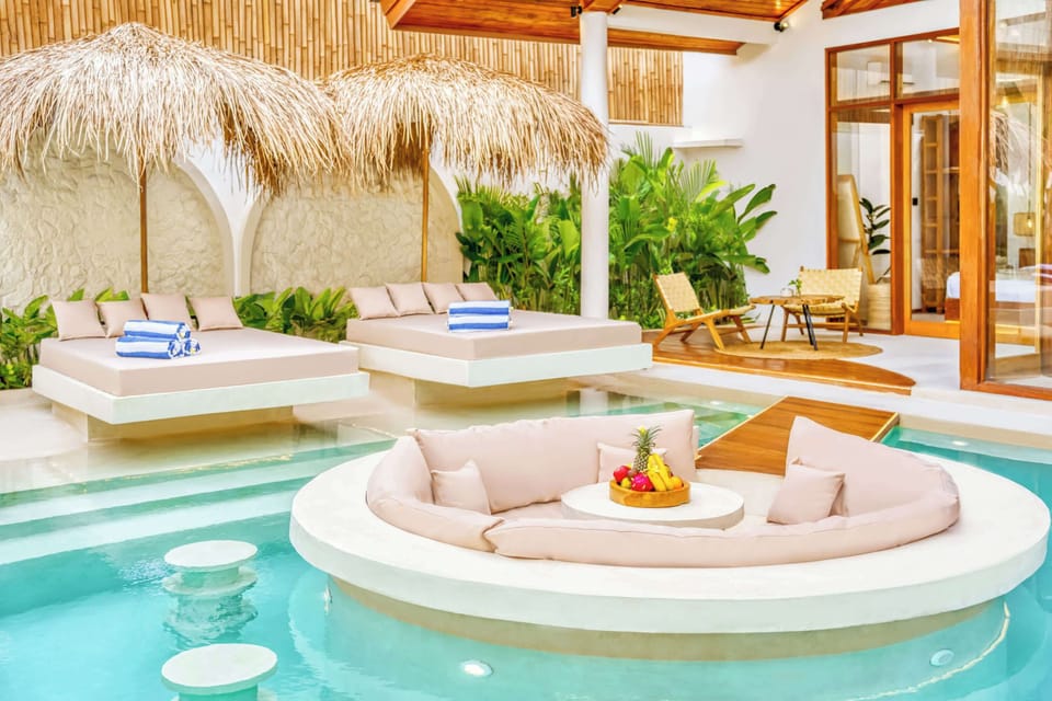 Relaxing tropical poolside escape with lush greenery