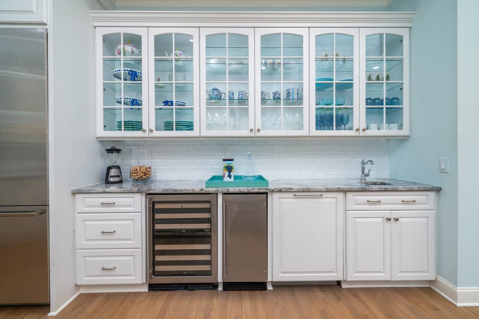 Expansive wet bar with wine fridge and ice machine.