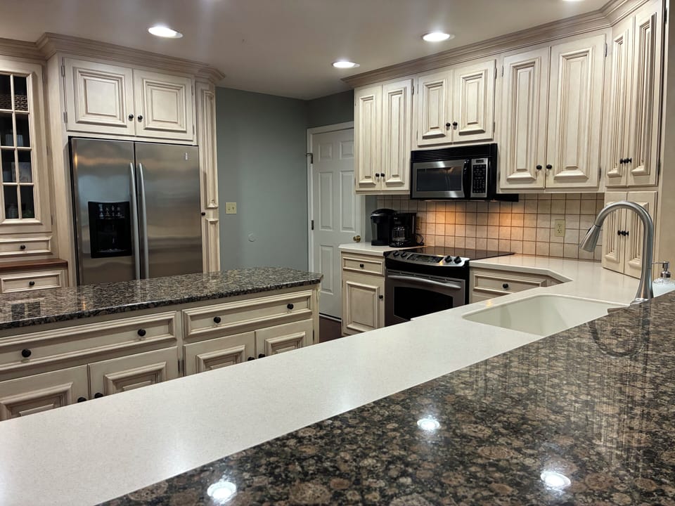 View of the kitchen from the barstools.  