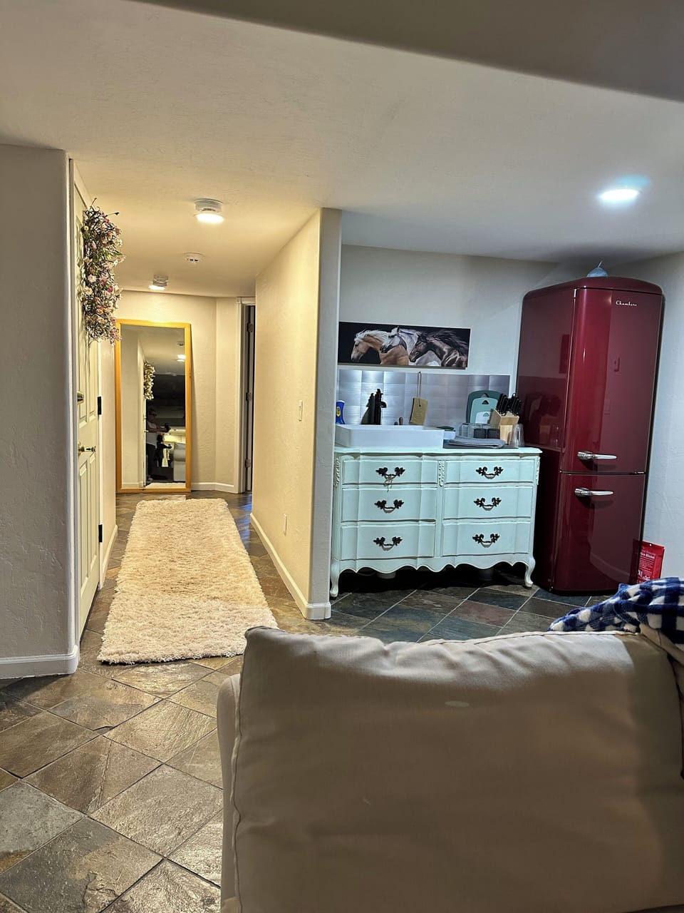 The hallway is next to the kitchenette, leads to 2 bedrooms/laundry and bathroom