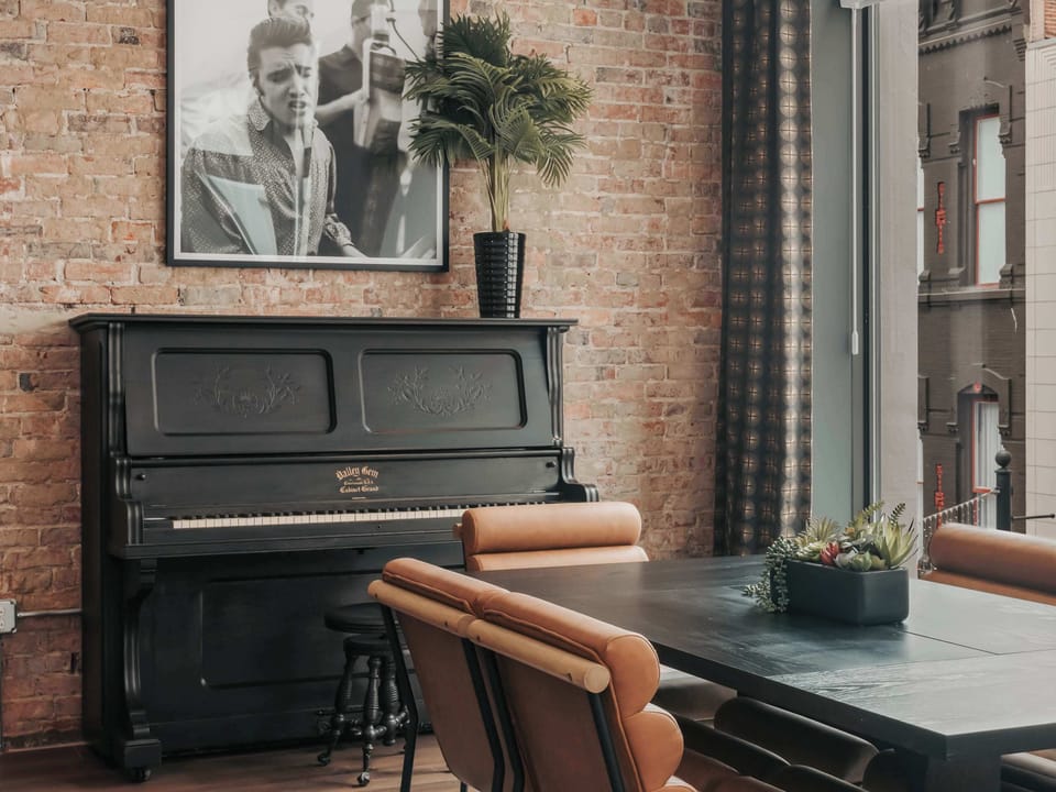 No stay at the Starr Piano Building is complete without taking a moment to play the piano—a nod to the building’s rich musical legacy.