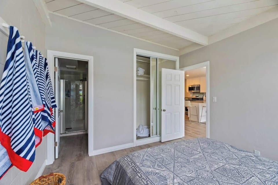Wake Up Refreshed: Bright and Airy Bedroom in Our Vacation Home. Beach towels and beach gear provided. 