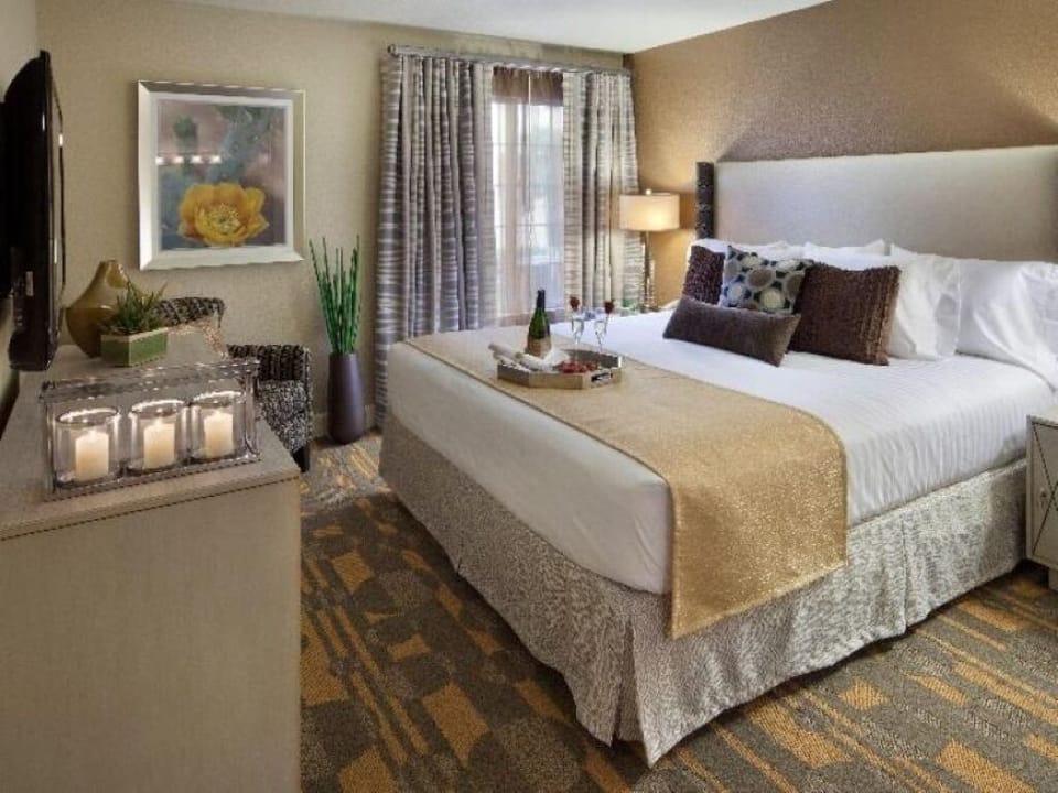 Stretch out in a spacious bed with soft, inviting pillows.