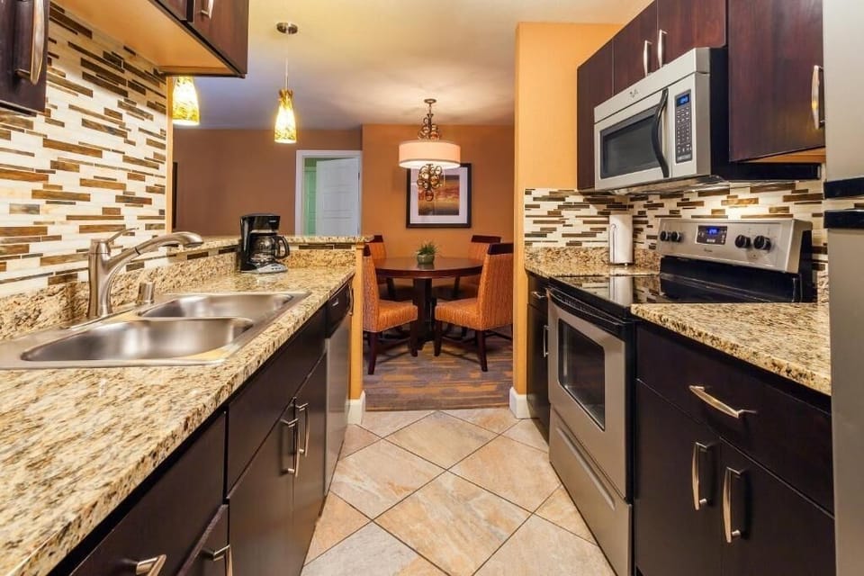 Prepare meals comfortably with a bright, well-equipped kitchen layout.