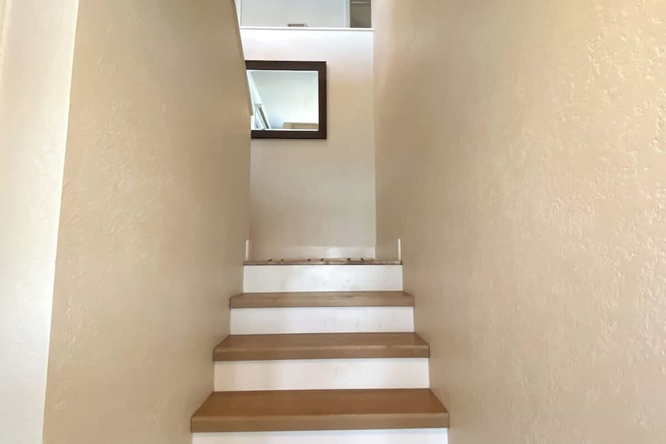 "U" set of steps with one landing between lower and upper level.