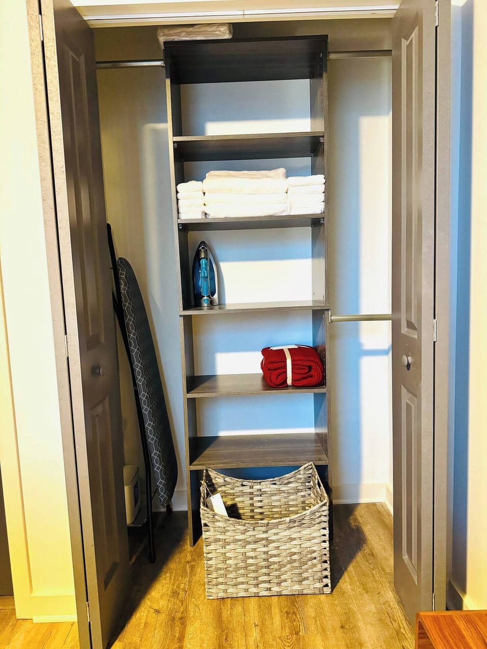 Iron, ironing board, hangers, extra sheets, pillows, comforter, and towels.