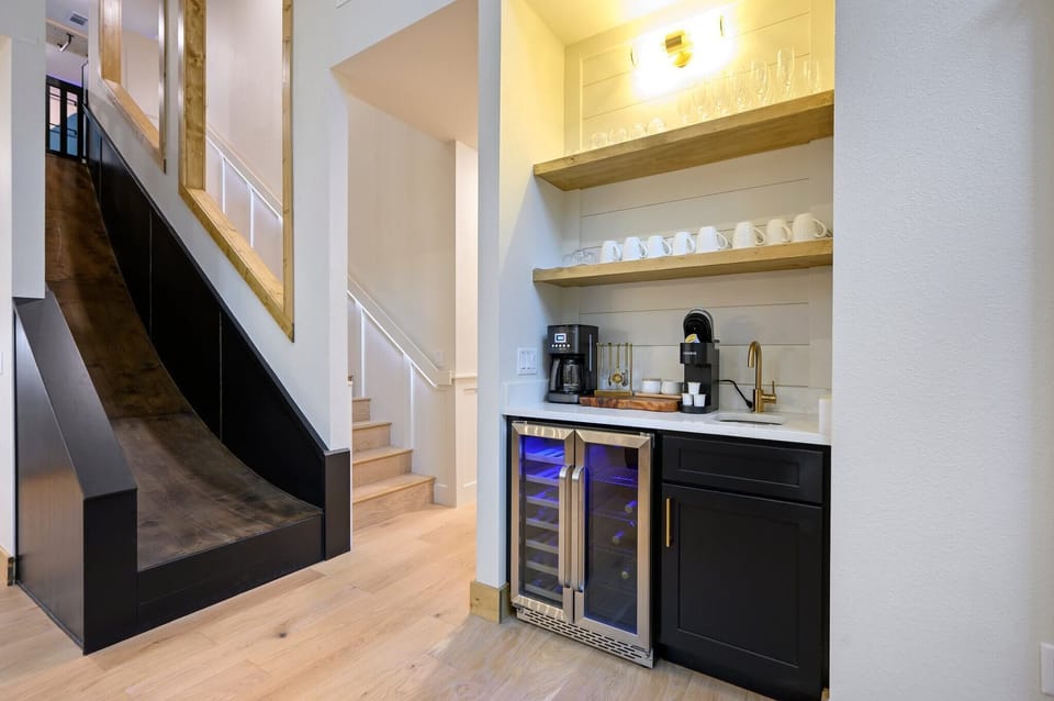 Enjoy morning brews and evening pours with our thoughtfully designed coffee bar and built-in wine cooler—perfect for every part of your day