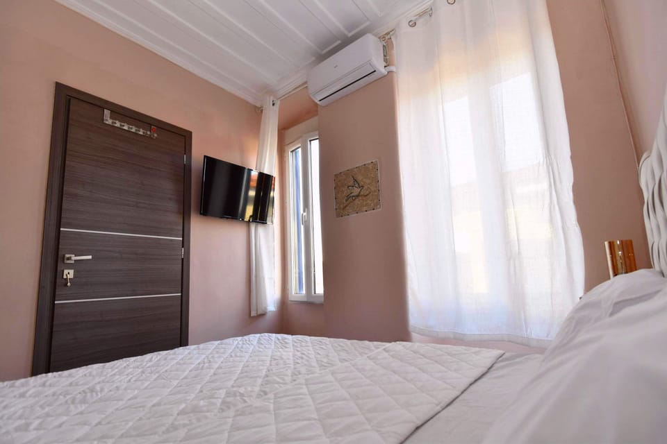 Stylish bedroom with sleek finishes, a TV and a welcoming feel