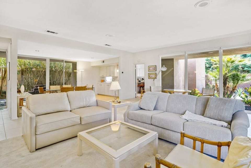 Bright and airy open-concept living room with seamless indoor-outdoor flow.