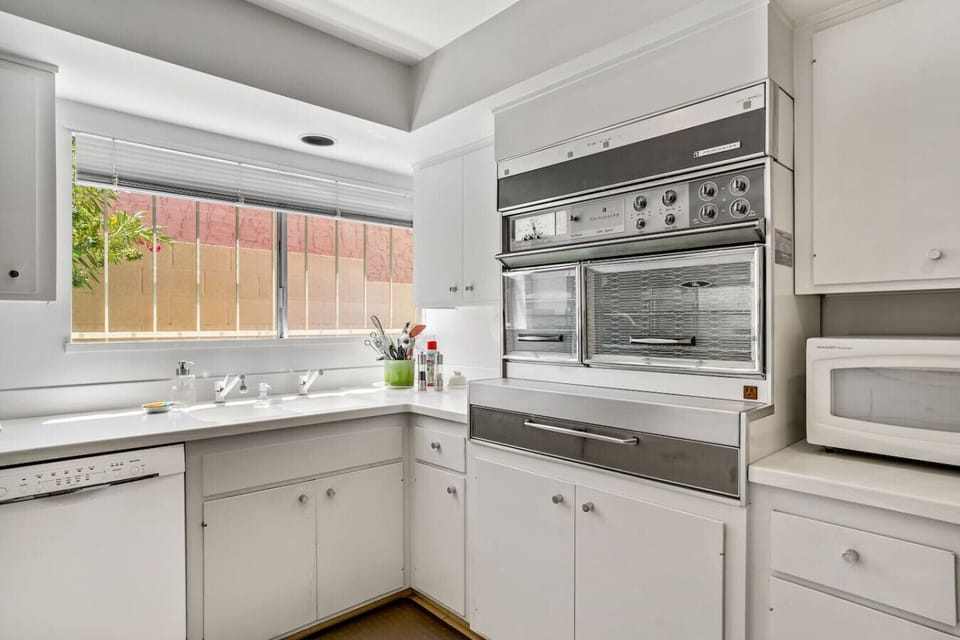 Cook like a pro in the fully stocked kitchen with Vintage 1960s appliances