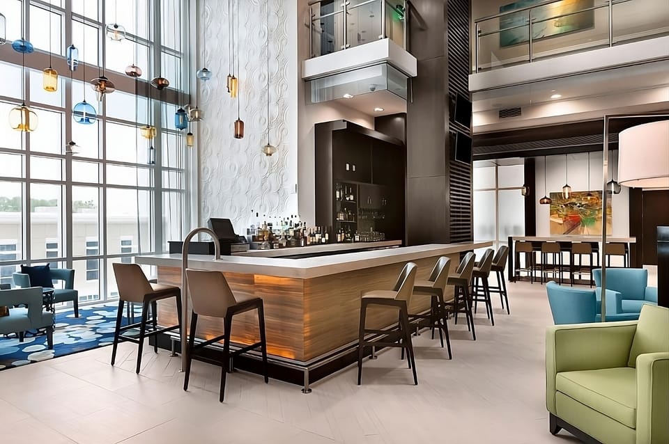 Sip cocktails beneath soaring windows in this stylish lobby bar