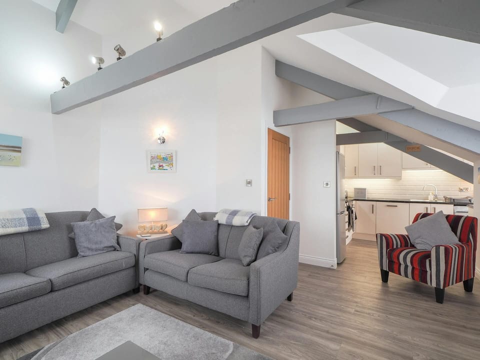 Armchair, sofas, beams in the ceiling