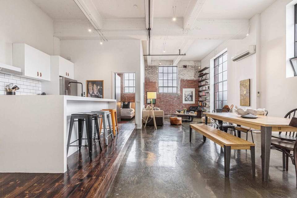 OPEN PLAN SPACES: A dramatic blend of height, light and space where 4m ceilings and warehouse character set the scene for effortless living.