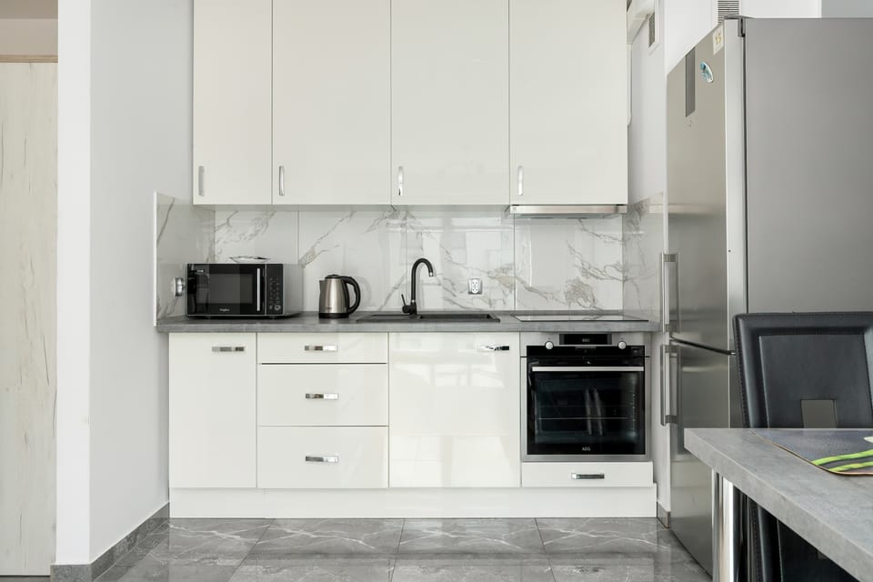 The fully equipped kitchenette includes everything you need for a home-cooked meal.