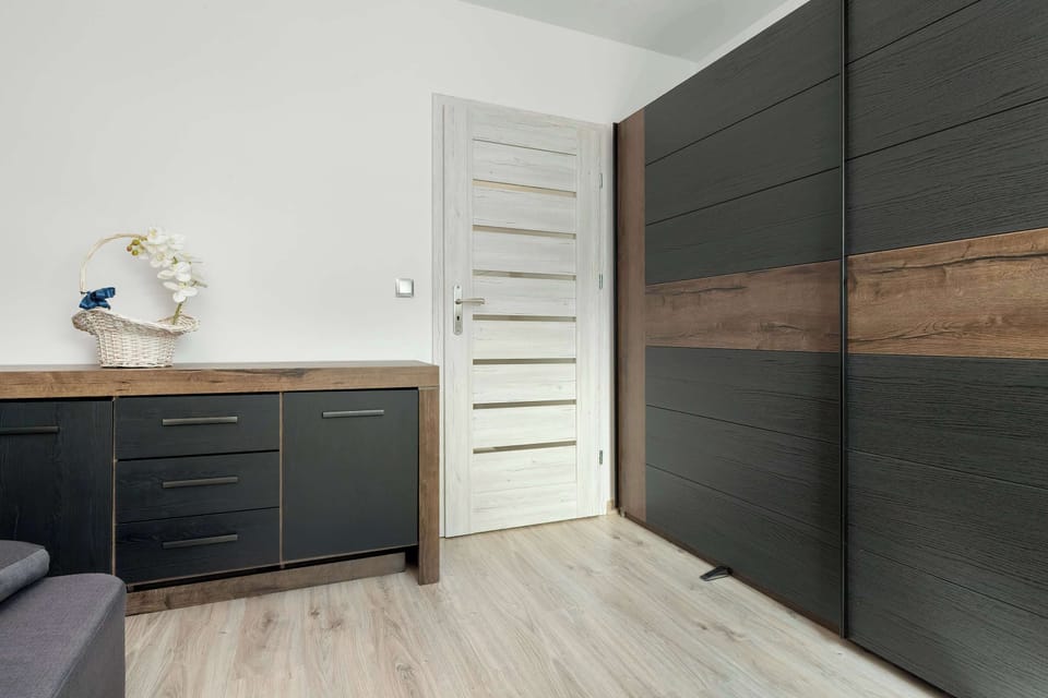 Enjoy the simplicity and comfort of the bedroom's modern design.