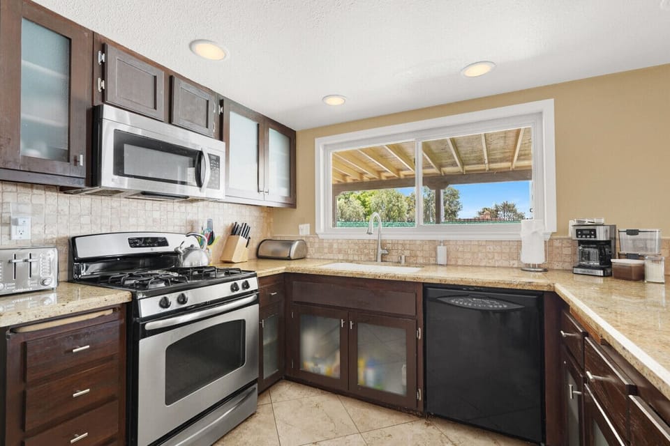 Modern kitchen is fully equipped with everything you need to cook at home, from appliances to cookware.