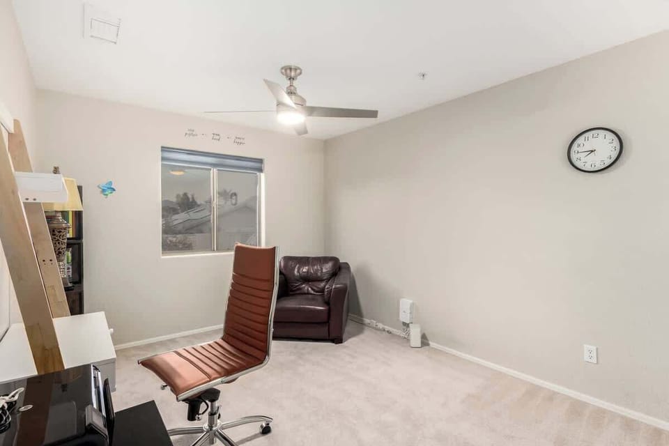 Den with desk, chair, and printer as a productive workspace
