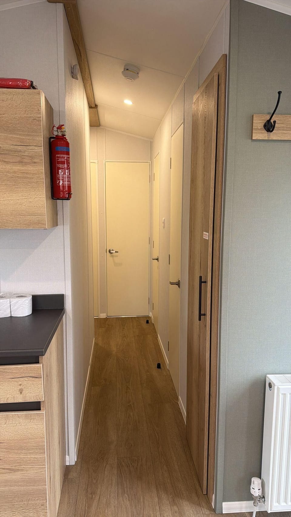 Bright, tidy hallway in our modern caravan, with smart built-in storage and a clean, practical layout for easy family stays. A great example of the comfort you’ll find at Welcome Family Holiday Park, perfectly placed for enjoying caravan sites and UK camp
