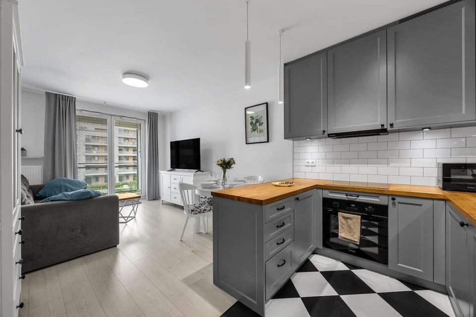 Living Room with Sofa Bed, Smart TV and Dining Table | Book Now with RENTUJEMY.COM
