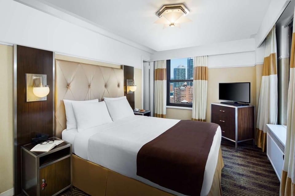 Sink into plush bedding and savor skyline views from bed.