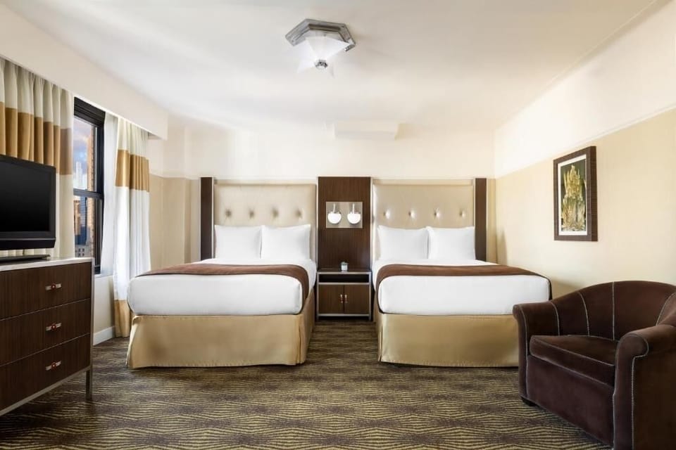 Stretch out comfortably with two plush beds and cozy seating.
