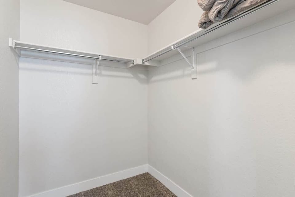 Primary bedroom walk in closet