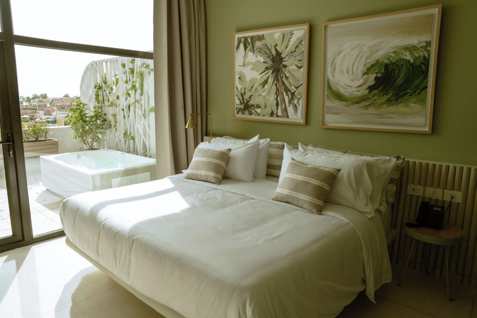 Ample king bed in room 10 Terrazas Hotel Boutique
