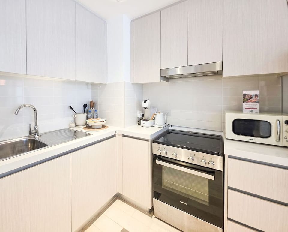 Enjoy the comfort of a fully equipped kitchen where modern convenience meets timeless design.