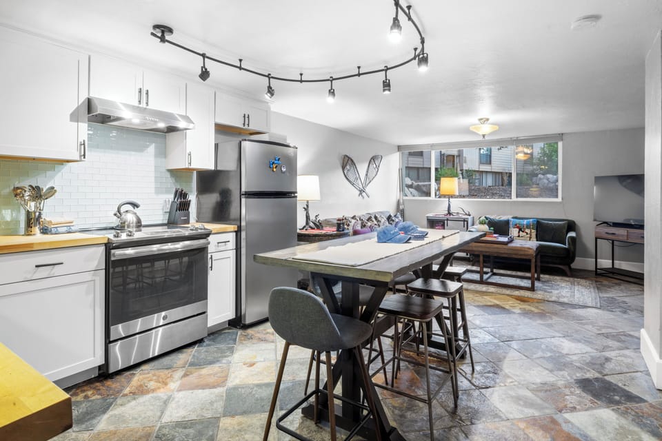 Upgrade your dining experience with a center table and barstool seating.
