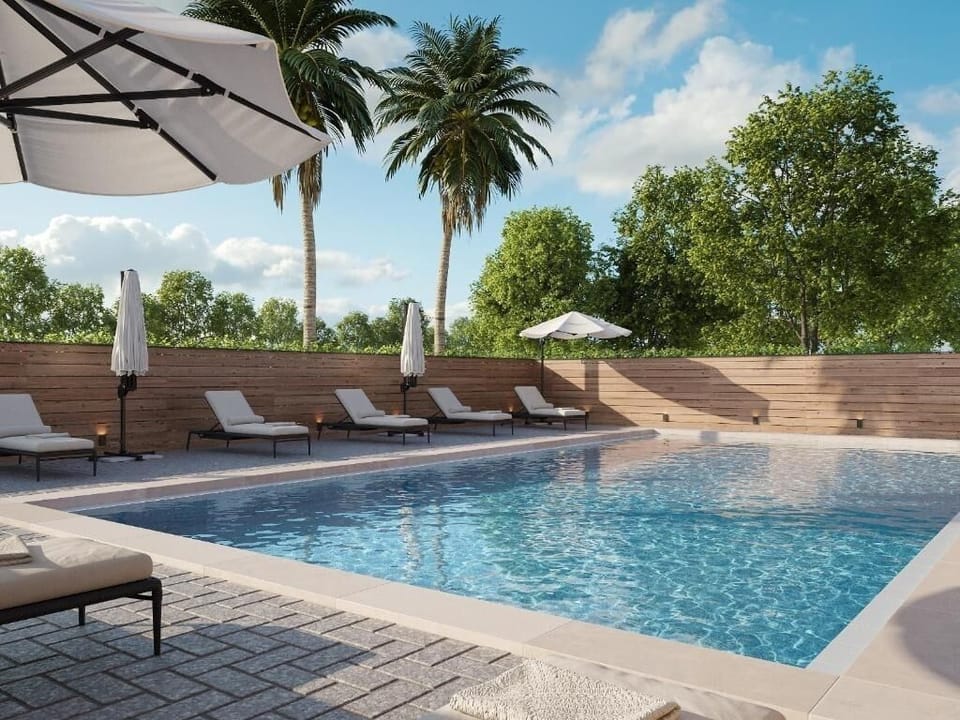 Unwind poolside in sparkling water and sun-drenched loungers.