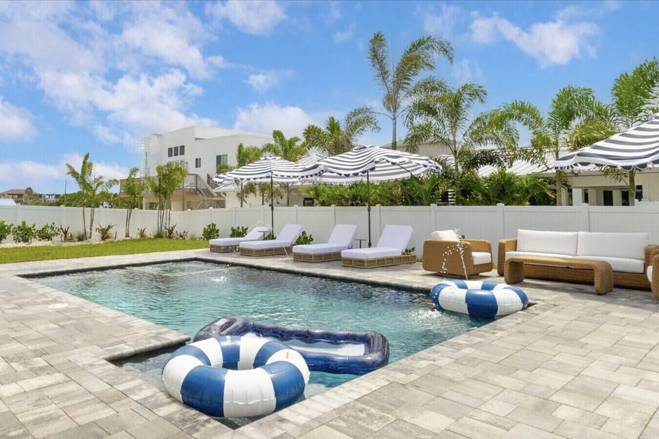 Private pool spa lounge chairs and umbrellas