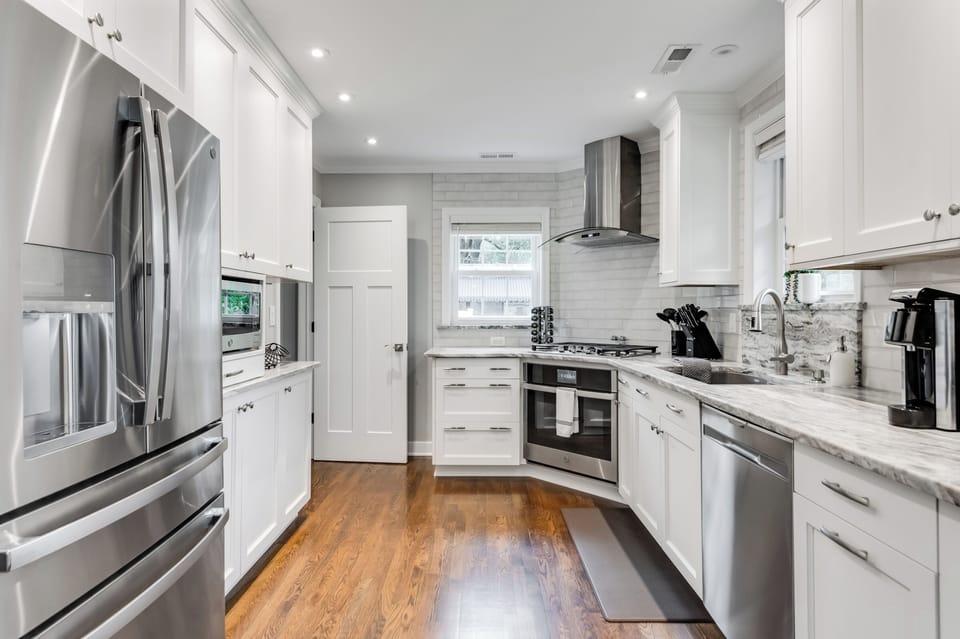 Bright and spacious kitchen with stainless steel appliances.