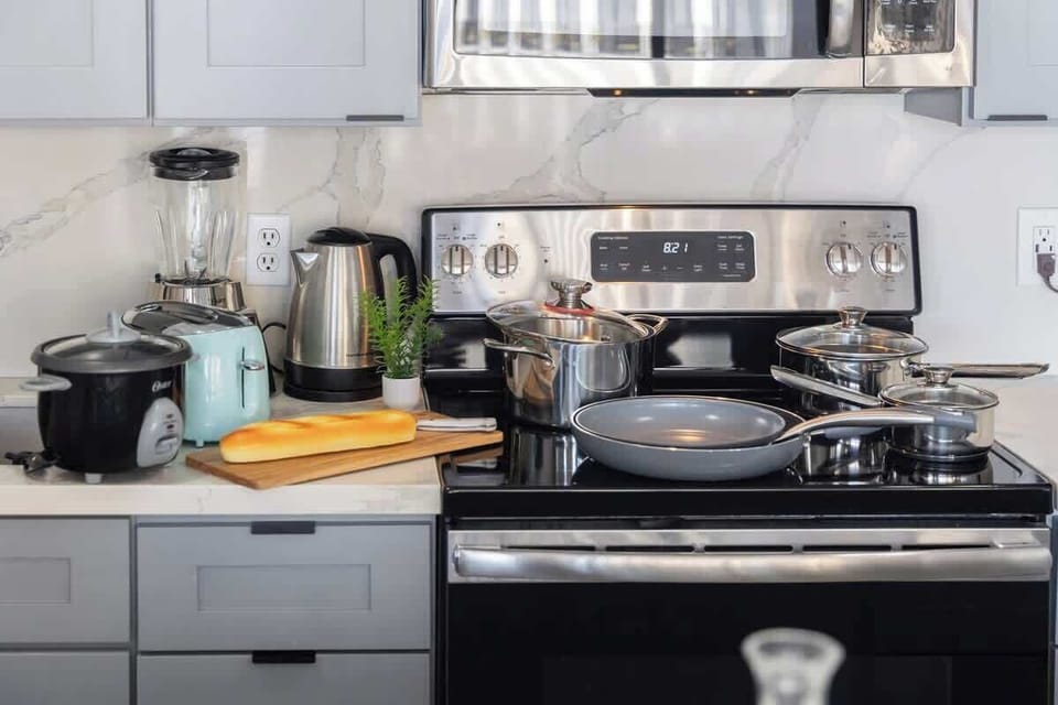 This fully-equipped kitchen provides everything you need, from a modern stove and microwave to small appliances for easy meal preparation.