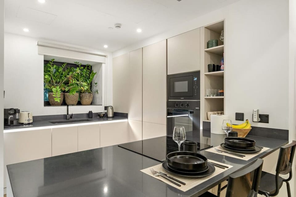 Modern Kitchen: Whip up culinary delights in this sleek, well-equipped kitchen with stylish decor!