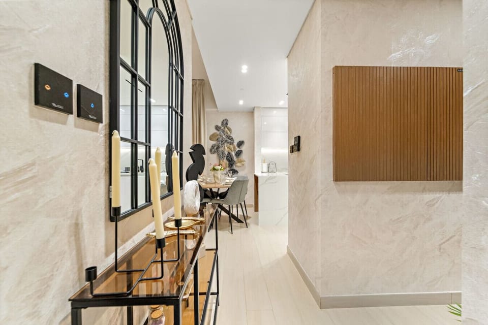 Chic Entryway: Step into luxury with elegant decor and a stylish dining area for memorable meals!