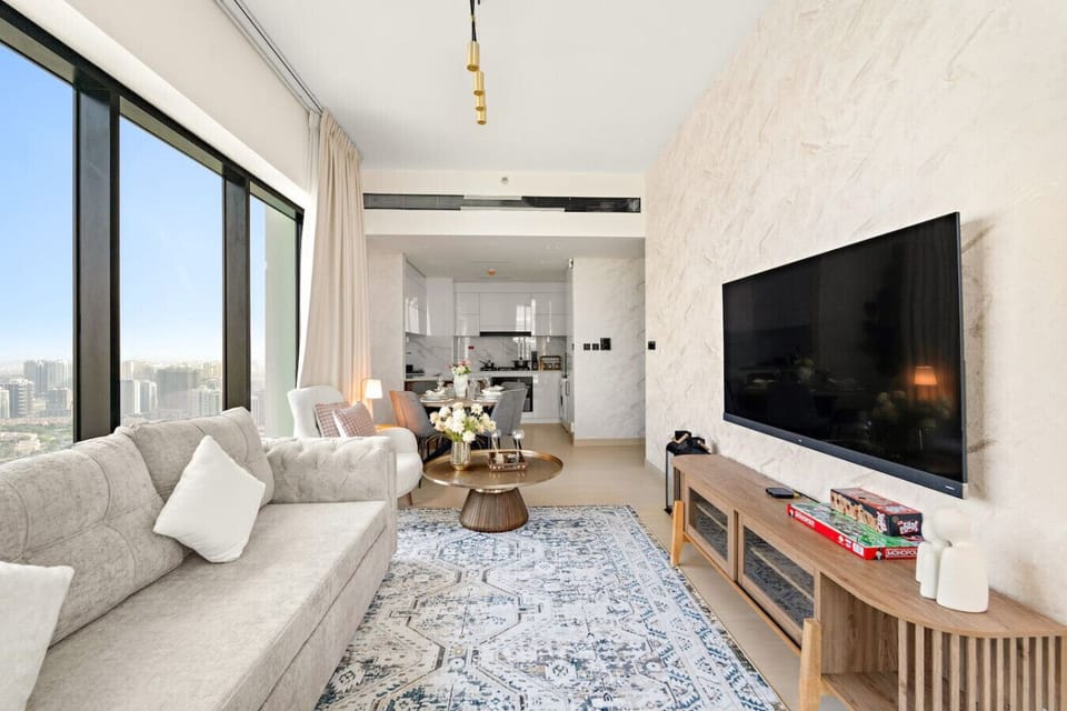 Living Room: Bright space with stylish decor, panoramic views, and a cozy spot for relaxation!